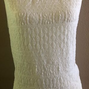 Women’s white lace handkerchief hem dress.